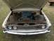 1960 Ford Starliner - Front view of a white 1960 Ford Starliner with its hood open, revealing the engine bay.