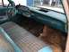 1960 Ford Starliner - Interior view of a 1960 Ford Starliner, its distinctive teal dashboard and patterned fabric seats.