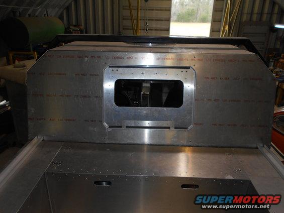 Aluminum panel with rectangular cutout and red stamped text