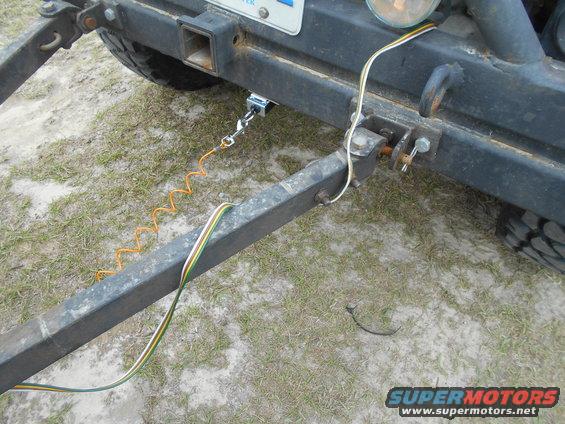 Trailer hitch with coiled safety cable and wiring harness