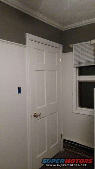 Interior door with brass handle and window with blinds