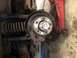 1979 Ford Bronco - Close-up view of a vehicle's wheel hub assembly, showing a spacer and a pink locking mechanism.