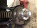 1979 Ford Bronco - Close-up of a wheel spacer installed on a vehicle's wheel hub assembly.
