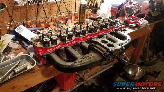 Offenhauser intake manifold and cylinder head on workbench