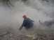 1979 Ford Bronco - A person is obscured by steam in a rocky outdoor environment. Supermotors.net logo is visible.