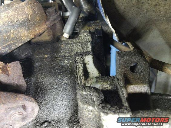 The clean spot on the block (LHR corner) is from oil flowing out of the valve cover gaskets.