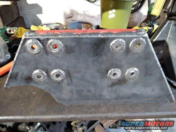 Welded metal part with eight bolt holes