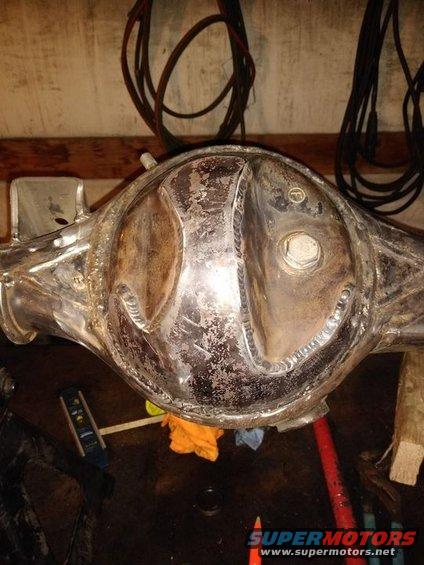 Chrome rear differential housing with visible welds and a bolt on top