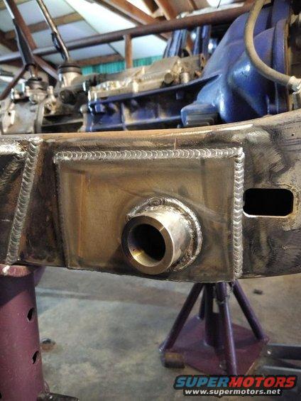 Close-up of a vehicle frame with a newly welded metal tube fitting