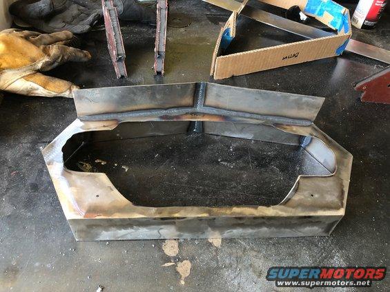Custom metal dashboard fabrication with welding marks