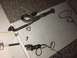 1993 Mercury Tracer - Tools and exhaust parts laid out on a concrete surface, possibly for repair or modification.