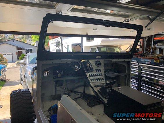 1992 Jeep Wrangler interior with dashboard removed, showing steering column, gear shifter, and gauges