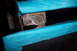 1995 Ford Bronco - Close-up of a damaged metal bracket secured with rivets and blue tape, with visible rust.