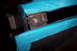1995 Ford Bronco - Close-up of a metal bracket with bolts, partially covered in blue tape, showing signs of wear and repair.