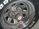 1978 Ford Bronco - Close-up of a chrome wheel and tire, showing white lettering on the sidewall.