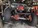 1992 Jeep Wrangler - Custom Jeep Wrangler chassis with engine and suspension modifications in a garage setting.