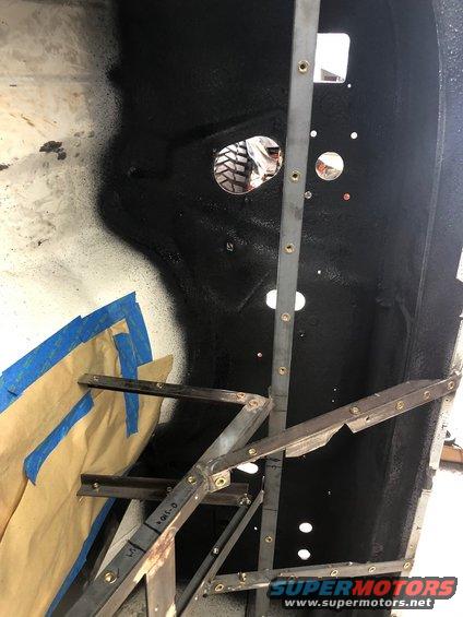 Interior body panel with metal bracing and taped-off section