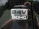 2002 Ford Taurus - A close-up of a 24V DOHC badge on a black vehicle's exterior.