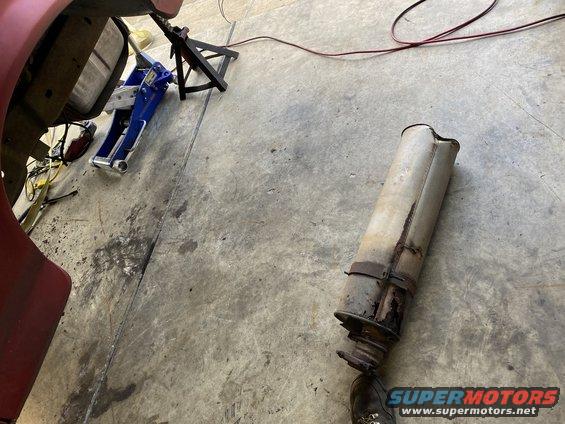 Exhaust pipe removed from vehicle on jack stands