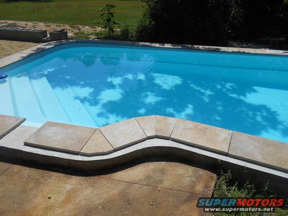 swimming pool with steps and tiled edge
