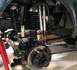 1979 Ford Bronco - Close-up view of a modified vehicle's front suspension system, highlighting custom shock absorbers and coil springs.