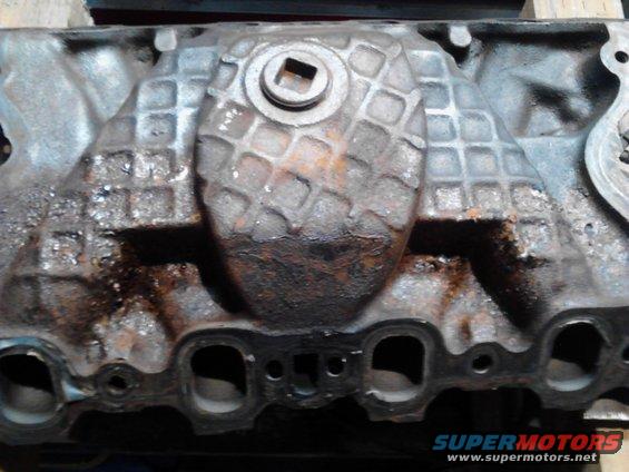 Engine intake manifold with textured cover and square bolt head