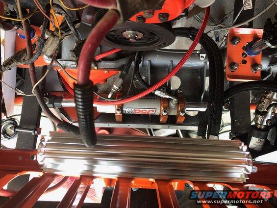 Engine bay with hydraulic cylinder labeled DSC and a large aluminum heat sink
