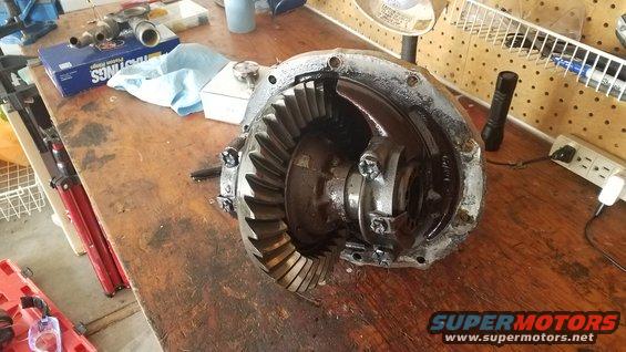 Differential carrier with ring and pinion gears on a workbench