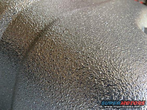 Silver textured metal part with a granular surface