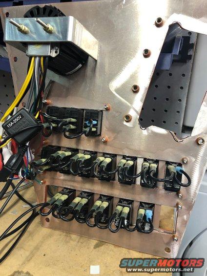 Custom electrical panel with multiple toggle switches, fuses, and wiring. Includes a 15A-250V label