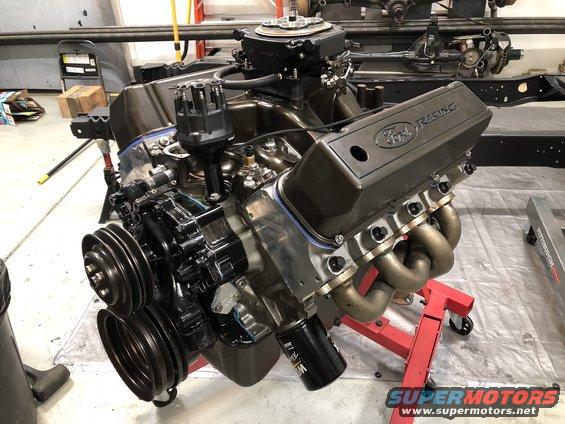 Engine assembly with black components and some red parts visible