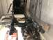 1979 Ford Bronco - Vehicle frame and suspension parts are shown, possibly for a 1979 Ford Bronco, in a workshop setting.