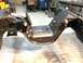 1979 Ford Bronco - This photo shows the frame and suspension components of a vehicle, likely in a workshop setting.