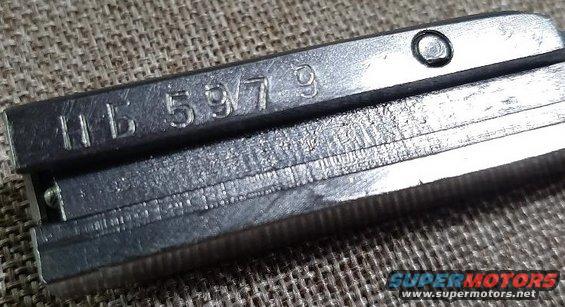 Metal part with stamped numbers HB 5979