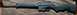 2003 Ford F-250 - A Keltec Sub 2000 rifle is shown from the side on a textured background.