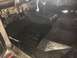 1978 Ford Bronco - The interior floor of a vehicle has been coated with a black protective spray liner.