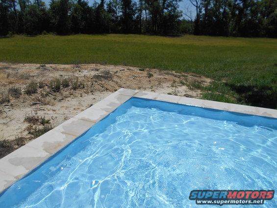Swimming pool with Supermotors.net logo