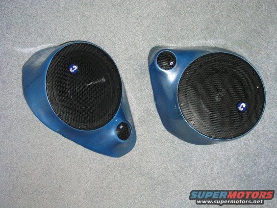 Pair of blue fiberglass car speaker pods with black mesh grilles and small tweeters