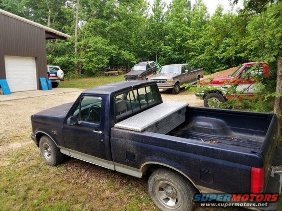fordfarm.jpg The blue & white Bronco isn't mine. My 5th truck is the '93 EB Bronco that's in pieces around back & inside.
