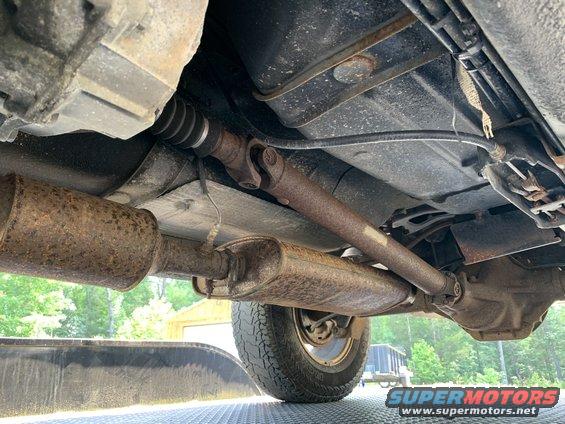 Undercarriage view showing driveshaft and exhaust system