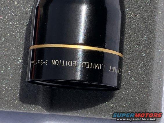 Black cylindrical part with gold band, marked 'CENTURY LIMITED EDITION 3-9x40mm'
