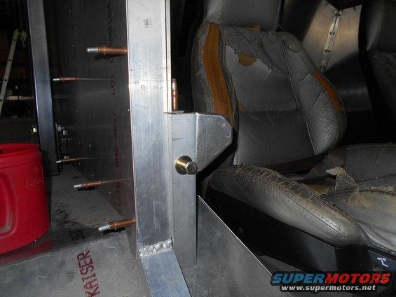 Torn seats and metal interior panels inside a vehicle