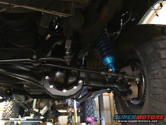Cut and turned TTB beams extend out the lower ball joint and allow the beams to pivot in the stock frame brackets and still get 4 inches of lift. Axle shafts have to be slightly modified to work at such a big angle.