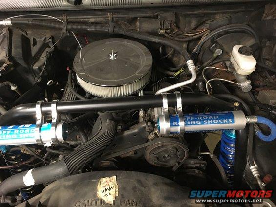 Final mounting of the front shock reservoirs.