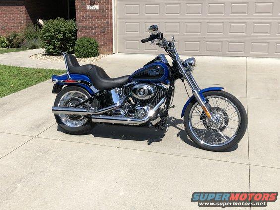 2008 Harley-Davidson Softail motorcycle parked in front of a garage
