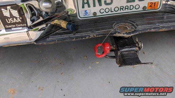 Rear bumper with USAA logo, Colorado license plate, and trailer hitch with red tow hook
