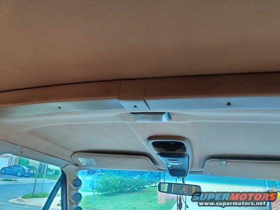 img_20200715_191432.jpg 20200715 - All of the rest of the interior is more or less layered over the top of each other, and needs to be disassembled top down. I started with this square piece straddling the roof and the fiberglass top in the center, and the two adjacent pieces. This, and the trim over the front windshield will need to be the first pieces removed. They are all just phillips trim screws.