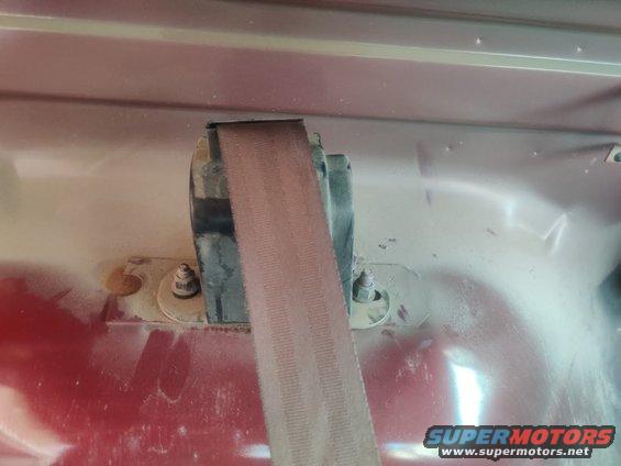 20200718 - The rear seat belts will have to come out completely since I can't get the side trim off without taking the seatbelts out. Here is the retractor behind the trim mounted with two 15mm bolts. The part bolted to the hard top is a t50 Torx as is the bolt to the bed of the truck. I had a lot of trouble with the driver bed bolt and had to torch it to get it to budge. I'm going to try to replace these with normal bolts.
