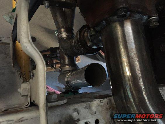 Custom exhaust pipes, likely part of an engine modification