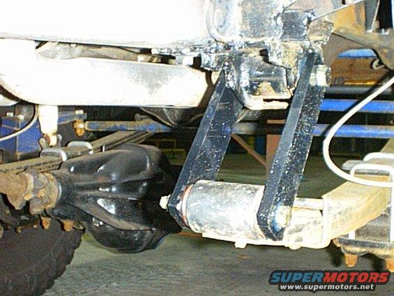 I lowered the front hanger bolts about 1 inch then made these shackles to even things out.  They are longer than before, a little thicker and have no h-bracket.